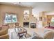 Comfortable living room with neutral decor, built-in shelving, a fireplace, and seating offering a cozy ambiance at 1363 Rolling Sunset St, Henderson, NV 89052