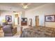 Spacious primary bedroom with sitting area, carpet floors, and neutral color palette at 1363 Rolling Sunset St, Henderson, NV 89052