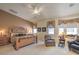 Large bedroom featuring a decorative headboard, bedside tables, and sitting area at 1363 Rolling Sunset St, Henderson, NV 89052