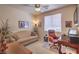 Comfortable home office featuring a sofa, desk, and natural light at 1363 Rolling Sunset St, Henderson, NV 89052