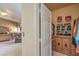 View from a bedroom looking into an organized walk-in closet with custom shelving and storage at 1363 Rolling Sunset St, Henderson, NV 89052