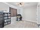 Bedroom featuring ceiling fan, desk, bookshelf, and grey carpet at 1395 Logandale Dr, Logandale, NV 89021