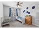 bedroom with carpet floors, ceiling fan, neutral walls, and honeycomb accents at 1395 Logandale Dr, Logandale, NV 89021