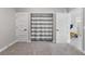 Bedroom includes closet, door to hallway, and soft carpet at 1395 Logandale Dr, Logandale, NV 89021