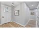 Inviting entryway with wood flooring, fresh paint, and stylish light fixture at 1395 Logandale Dr, Logandale, NV 89021