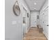 Hallway with a combination of carpet and wood flooring and neutral wall color at 1395 Logandale Dr, Logandale, NV 89021