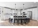 Bright kitchen with modern appliances, white cabinets, and a large center island at 1395 Logandale Dr, Logandale, NV 89021