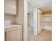Hallway view into the bathroom with shower-tub combo and vanity at 1851 Hillpointe Rd # 2412, Henderson, NV 89074