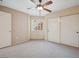 Neutral toned bedroom with standard closet, ceiling fan and natural light from window at 1851 Hillpointe Rd # 2412, Henderson, NV 89074