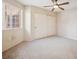 Bright bedroom featuring a ceiling fan, closet, and a large window at 1851 Hillpointe Rd # 2412, Henderson, NV 89074