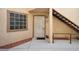 Front entrance with a security screen door and stair access at 1851 Hillpointe Rd # 2412, Henderson, NV 89074