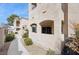 Exterior building view with walkways and nicely maintained landscaping at 1851 Hillpointe Rd # 2412, Henderson, NV 89074