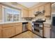 Bright kitchen boasts modern stainless steel appliances and ample cabinet space at 1851 Hillpointe Rd # 2412, Henderson, NV 89074