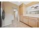 Bright kitchen featuring tile floors, stainless steel appliances, and ample cabinetry at 1851 Hillpointe Rd # 2412, Henderson, NV 89074