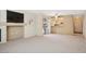 Spacious living room with a fireplace, and sliding door access to the balcony at 1851 Hillpointe Rd # 2412, Henderson, NV 89074