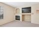 Inviting living room with a fireplace, mounted TV, and a bright window at 1851 Hillpointe Rd # 2412, Henderson, NV 89074