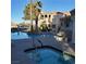 Community pool and spa featuring a well maintained deck and landscaping at 1851 Hillpointe Rd # 2412, Henderson, NV 89074