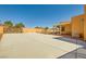 This outdoor space features a large concrete parking area with a covered patio and stucco privacy wall at 2201 Rosanna St, Las Vegas, NV 89117