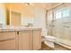 Bright bathroom featuring a glass enclosed shower, wood-look flooring, and white vanity at 2201 Rosanna St, Las Vegas, NV 89117