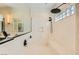 Modern bathroom boasts a sleek shower with a rainfall showerhead and frameless glass enclosure at 2201 Rosanna St, Las Vegas, NV 89117