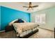 Cozy bedroom featuring a large bed, ceiling fan, and ample natural light through the window at 2201 Rosanna St, Las Vegas, NV 89117