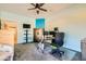 Spacious bedroom with ceiling fan, large window, and security safe at 2201 Rosanna St, Las Vegas, NV 89117
