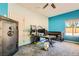 Bright bedroom with modern desk, security safe, and neutral carpet at 2201 Rosanna St, Las Vegas, NV 89117
