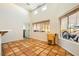 Bright dining room with Saltillo tile, flooded with natural light from ample windows at 2201 Rosanna St, Las Vegas, NV 89117