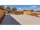 The property features a concrete driveway and secure gate surrounded by a private stucco wall at 2201 Rosanna St, Las Vegas, NV 89117