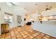 Spacious living area with a tile floor leading to a kitchen and a dining area at 2201 Rosanna St, Las Vegas, NV 89117