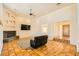 Open living room with tile flooring, fireplace, and access to an enclosed patio at 2201 Rosanna St, Las Vegas, NV 89117