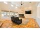 Living room featuring tile flooring, fireplace, and an open floor plan at 2201 Rosanna St, Las Vegas, NV 89117