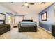 Bright main bedroom featuring a blue accent wall, carpet, and a custom bed with storage at 2201 Rosanna St, Las Vegas, NV 89117