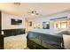 Large main bedroom with custom built-in storage, neutral carpet, and an attached sunroom at 2201 Rosanna St, Las Vegas, NV 89117