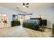 Spacious main bedroom featuring french doors and custom bed frame with storage at 2201 Rosanna St, Las Vegas, NV 89117