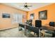 Home office featuring a ceiling fan, neutral walls, and abundant natural light through the windows at 2201 Rosanna St, Las Vegas, NV 89117