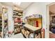 Organized storage space with shelving, boxes, and a workbench perfect for hobbies and projects at 2201 Rosanna St, Las Vegas, NV 89117