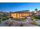 A spacious covered patio and meticulous desert landscaping enhance this home's outdoor charm at 2220 Canyonville Dr, Henderson, NV 89044