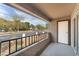 A covered balcony offers outdoor living space with wrought iron railings and neighborhood views at 2606 S Durango Dr # 287, Las Vegas, NV 89117