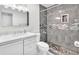 Bathroom featuring a tiled shower, vanity, and toilet at 2606 S Durango Dr # 287, Las Vegas, NV 89117