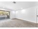 Bedroom with new carpet, neutral walls, and sliding door to balcony at 2606 S Durango Dr # 287, Las Vegas, NV 89117