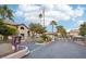 Exterior view of a gated community entrance with manicured landscaping and common areas on a clear, sunny day at 2606 S Durango Dr # 287, Las Vegas, NV 89117