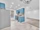 Modern kitchen with stainless steel appliances, blue cabinetry, and tile floors at 2606 S Durango Dr # 287, Las Vegas, NV 89117