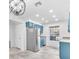Modern kitchen with stainless steel appliances, blue cabinetry, and bright lighting at 2606 S Durango Dr # 287, Las Vegas, NV 89117
