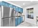 Bright kitchen features stainless steel appliances and light blue cabinets at 2606 S Durango Dr # 287, Las Vegas, NV 89117