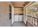 Enclosed outdoor laundry area featuring a white washer and dryer, convenient and space-saving design at 2606 S Durango Dr # 287, Las Vegas, NV 89117