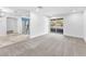 Bright living room with new carpet, neutral walls, and sliding door to balcony at 2606 S Durango Dr # 287, Las Vegas, NV 89117