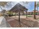 The community pergola with a brick patio offers shade and a gathering space at 2606 S Durango Dr # 287, Las Vegas, NV 89117
