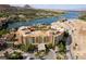Beautiful aerial view of resort-style lakeside community with a terracotta-roofed buildings and mountain views at 30 Strada Di Villaggio # 409, Henderson, NV 89011