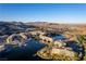 Panoramic aerial view of Lake Las Vegas featuring waterways, European-style buildings, and mountain scenery at 30 Strada Di Villaggio # 409, Henderson, NV 89011